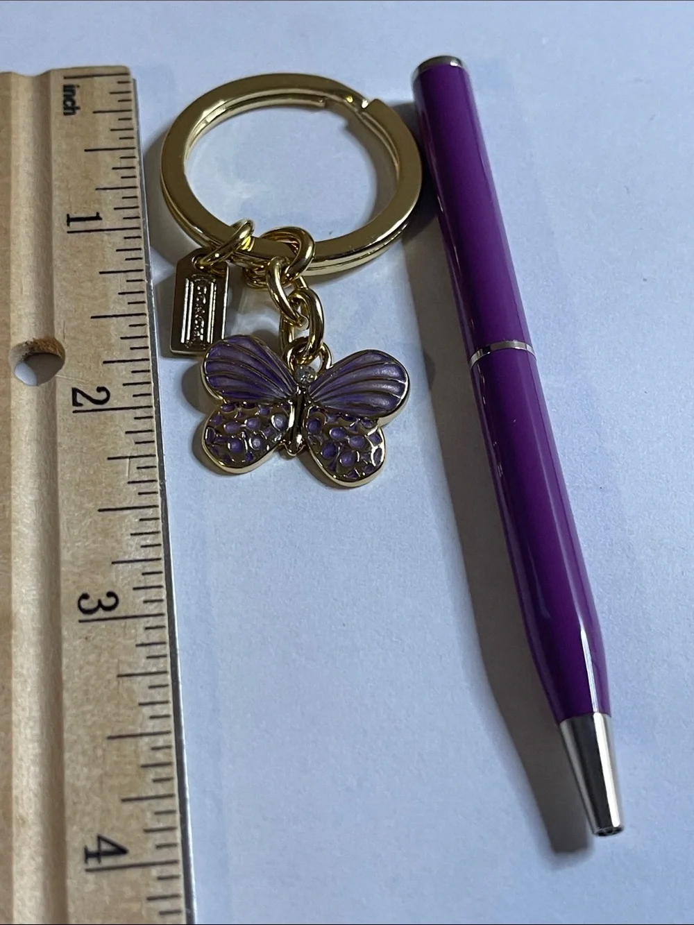 Coach Gold Butterfly Keyring with Purple Enamel and Coach Pen